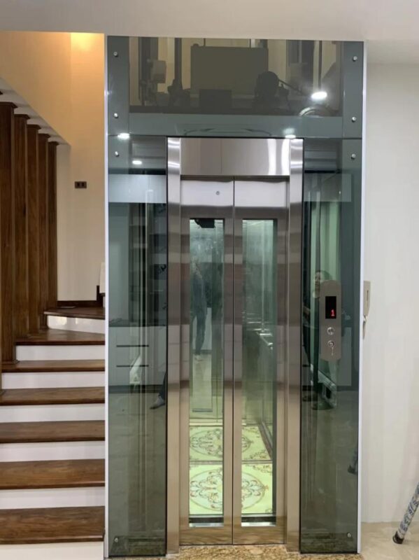 Ốp inox cho thang máy bằng kính